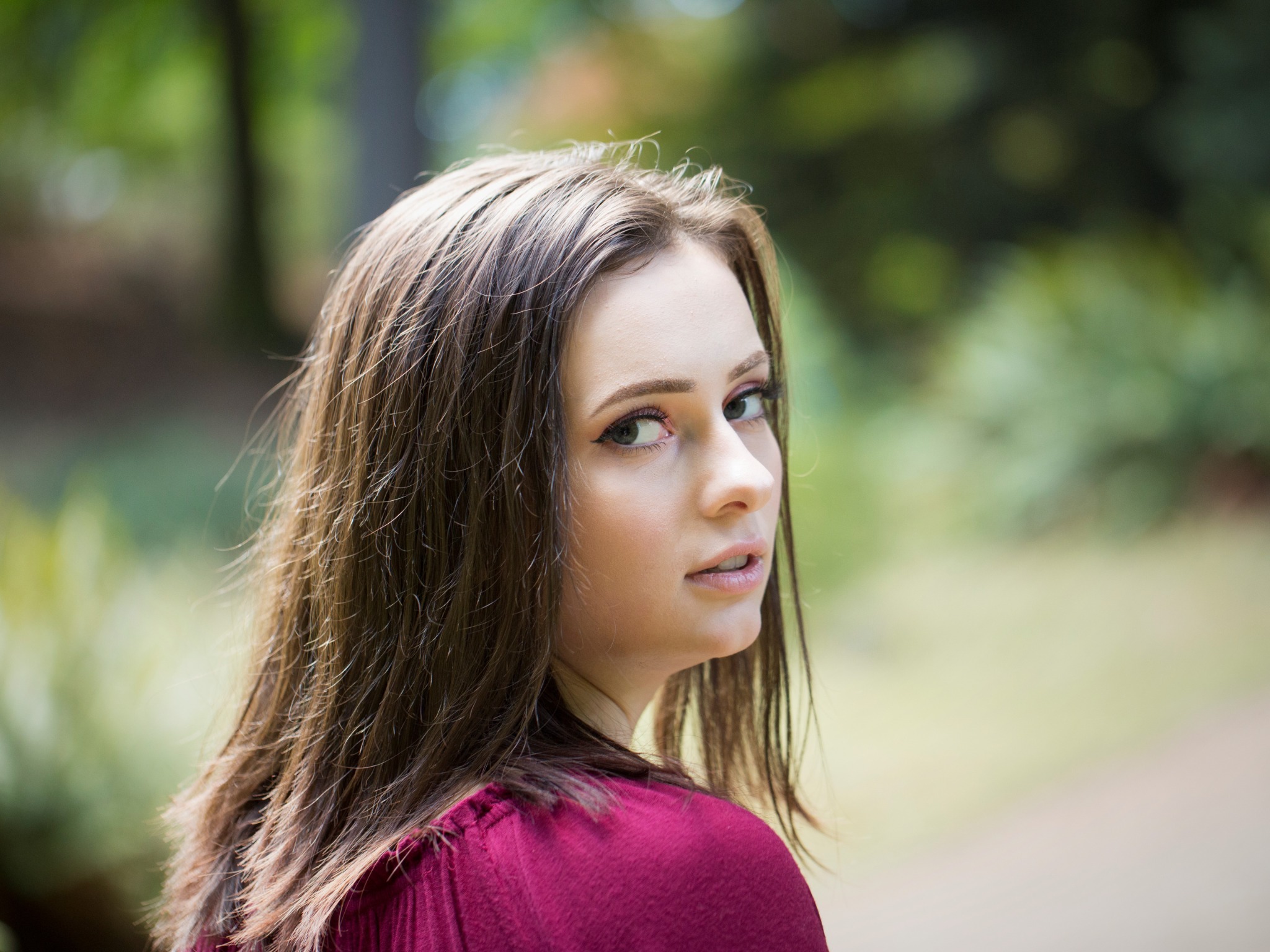 Over-the-shoulder portrait outdoors