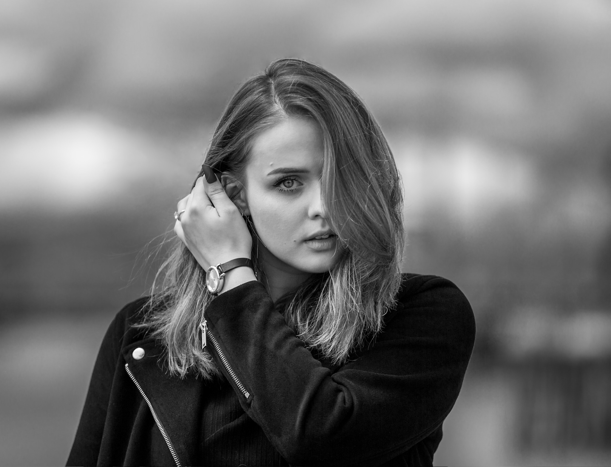Black-and-white portrait in a dark jacket