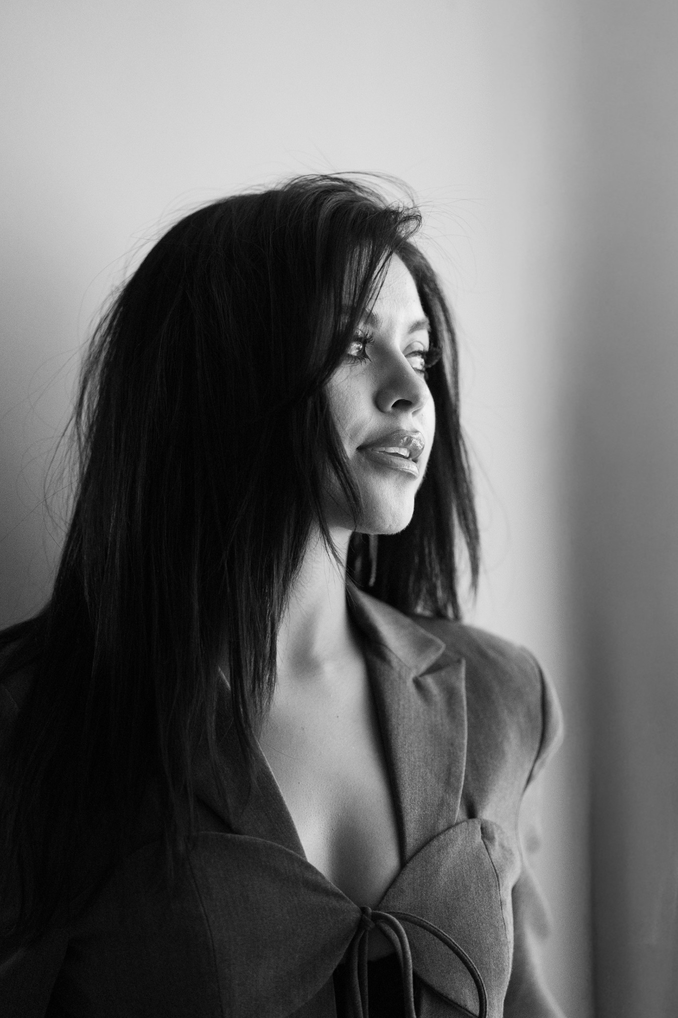 Black-and-white portrait in soft window light
