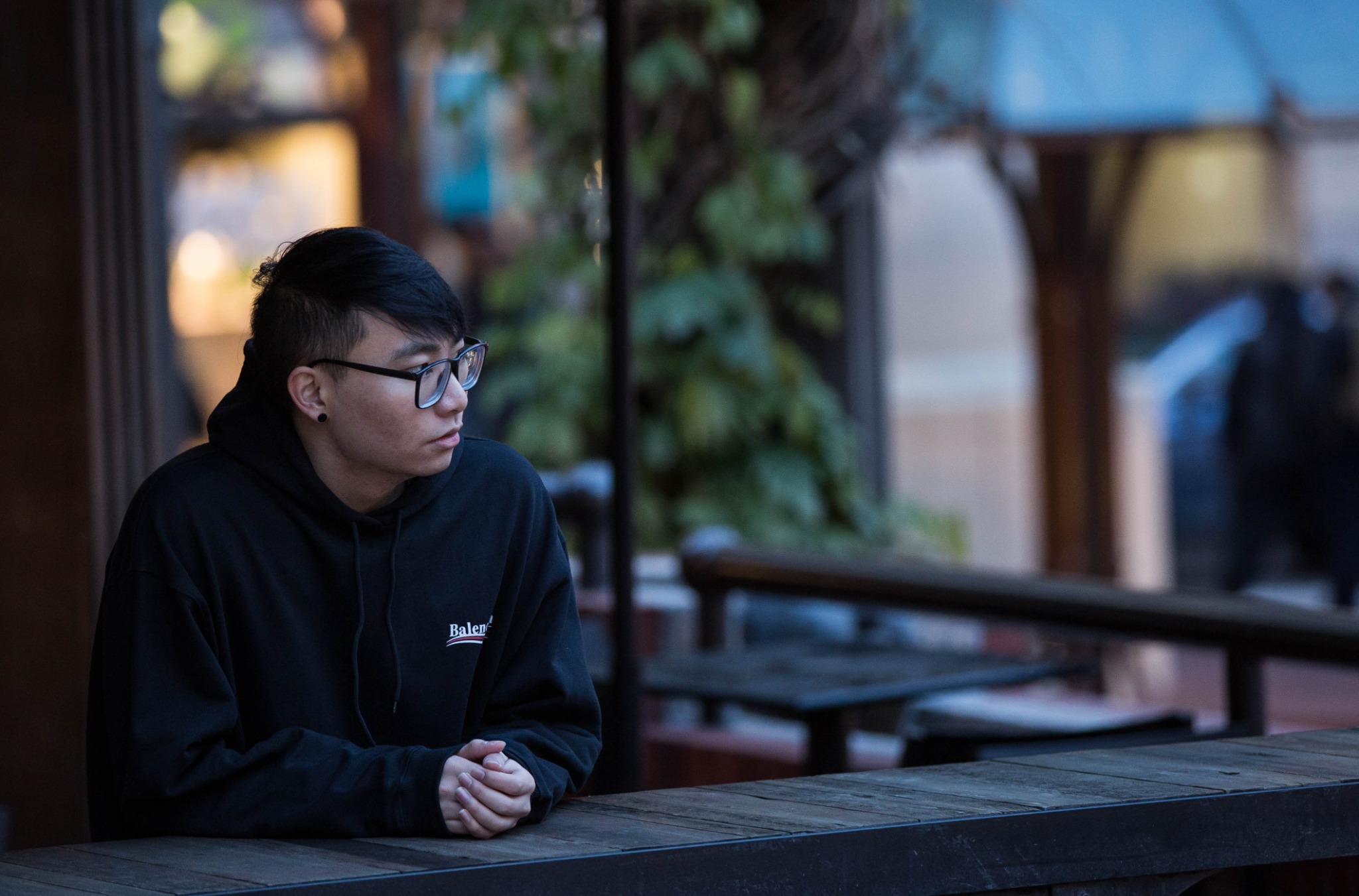 Environmental portrait at an outdoor cafe